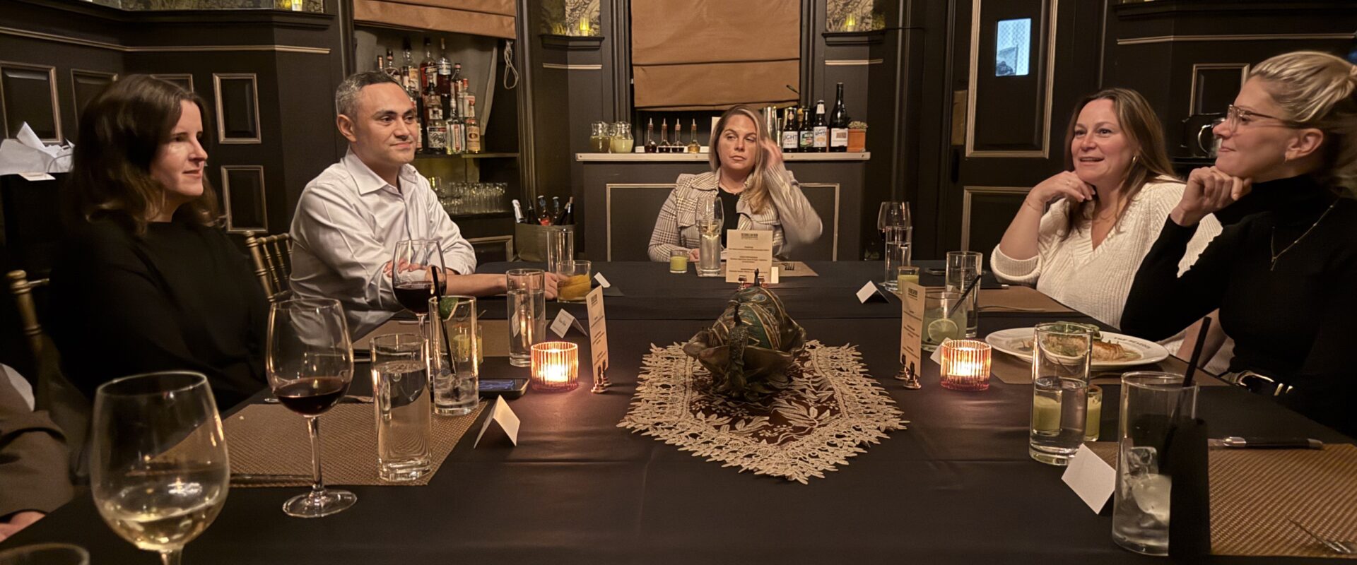 Retail and brand executives in conversation over dinner at an RTM Nexus event